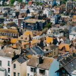 Aerial view of the historic rooftops in Hastings, England showcasing diverse architecture and vibrant colors.