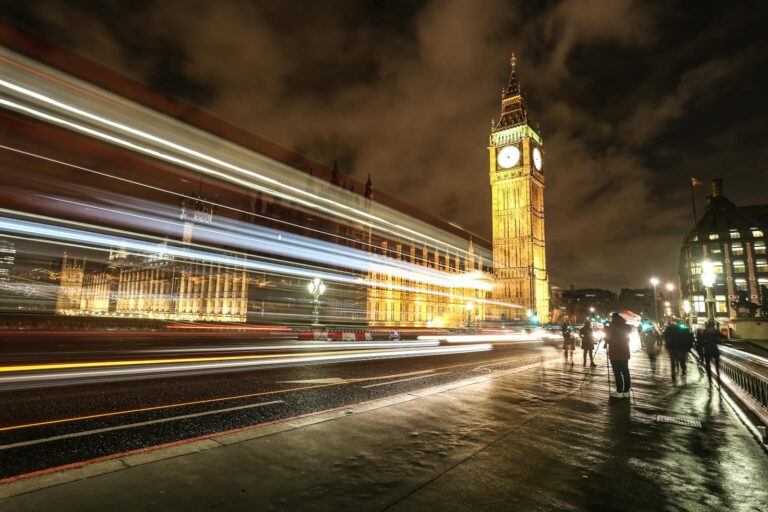 Captivating long exposure of Big Ben with light streaks and urban nightscape in London.